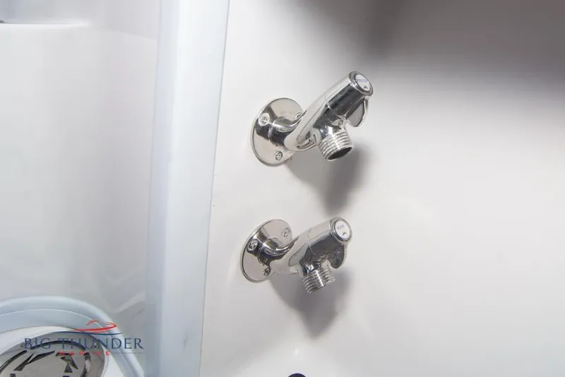 Slide: The Image of 2022 Fountain 38 SC boat interior with modern dashboard in showroom setting. - 24