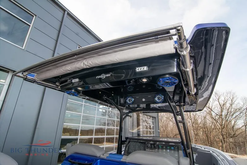 Slide: The Image of 2022 Fountain 38 SC boat interior with hexagonal flooring and fire extinguisher. - 27