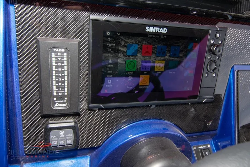 Slide: The Image of 2022 Fountain 38 SC boat bathroom with toilet and control panel. - 33