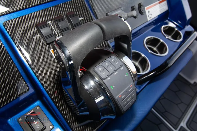 Slide: The Image of Control panel of 2022 Fountain 38 SC boat with switches and keys. - 34