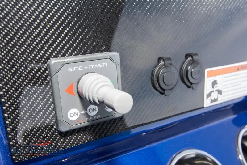 Slide: The Image of Control panel of 2022 Fountain 38 SC boat with labeled switches and keys. - 35