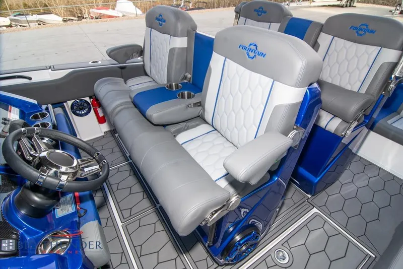 Slide: The Image of 2022 Fountain 38 SC boat interior with luxurious seating and blue LED lighting. - 41