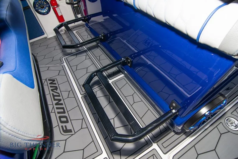 Slide: The Image of 2022 Fountain 38 SC boat interior with blue LED lighting and modern design elements. - 42