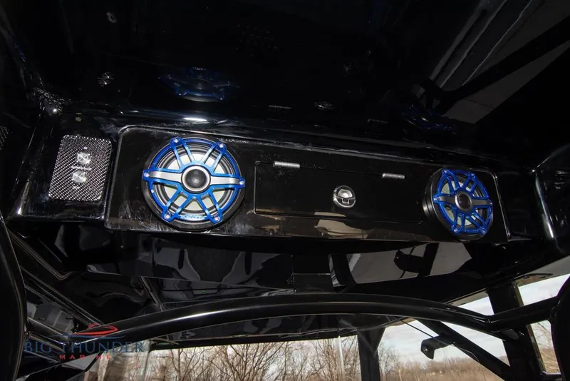 Slide: The Image of Interior of 2022 Fountain 38 SC boat with blue lighting and storage compartment. - 43