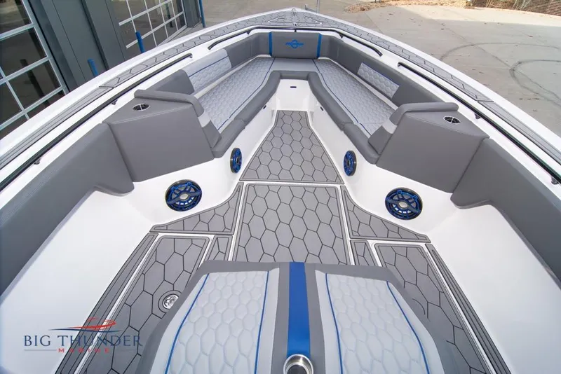 Slide: The Image of 2022 Fountain 38 SC boat dashboard with steering wheel, controls, and digital displays. - 48