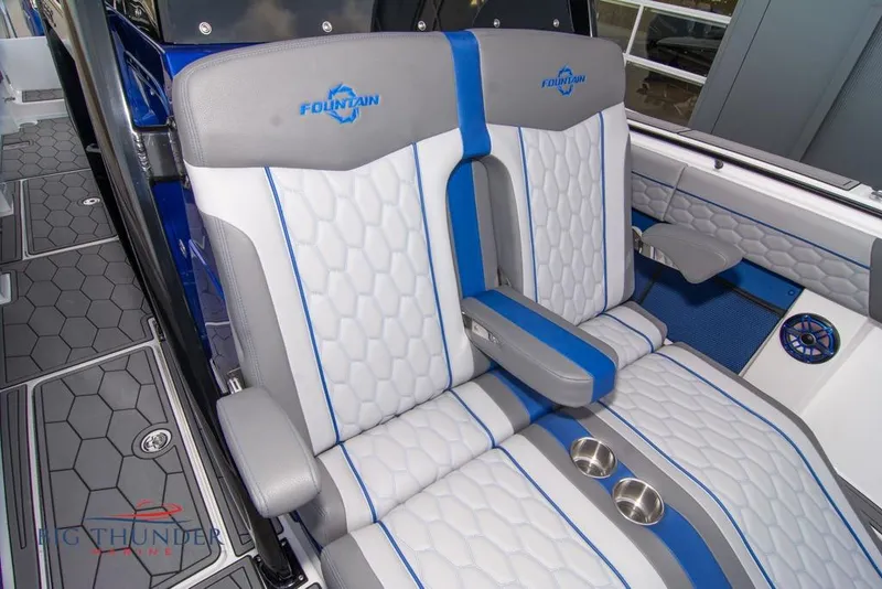 Slide: The Image of 2022 Fountain 38 SC boat interior with blue-lit speakers and modern dashboard. - 54
