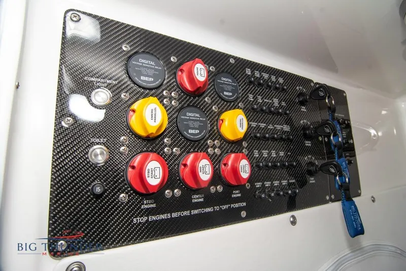 Slide: The Image of 2022 Fountain 38 SC boat interior with illuminated seating and canopy in showroom. - 58