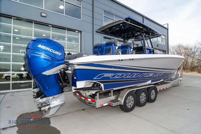 Slide: The Image of 2022 Fountain 38 SC boat with triple 400 horsepower engines on the water. - 6