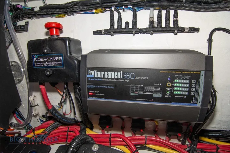 Slide: The Image of Interior view of 2022 Fountain 38 SC boat, featuring control panel and key slot. - 60