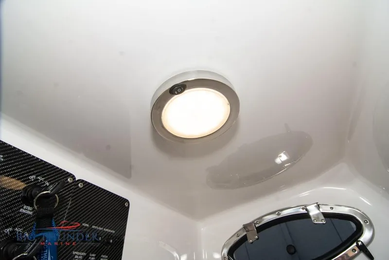 Slide: The Image of 2022 Fountain 38 SC boat interior with modern dashboard and blue LED lighting. - 62
