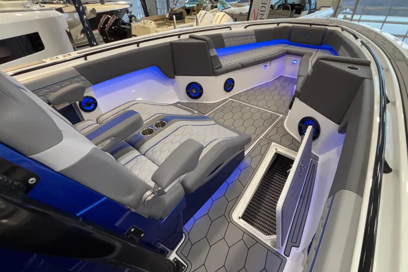Slide: The Image of 2022 Fountain 38 SC boat interior with blue LED lighting and hexagonal flooring. - 70