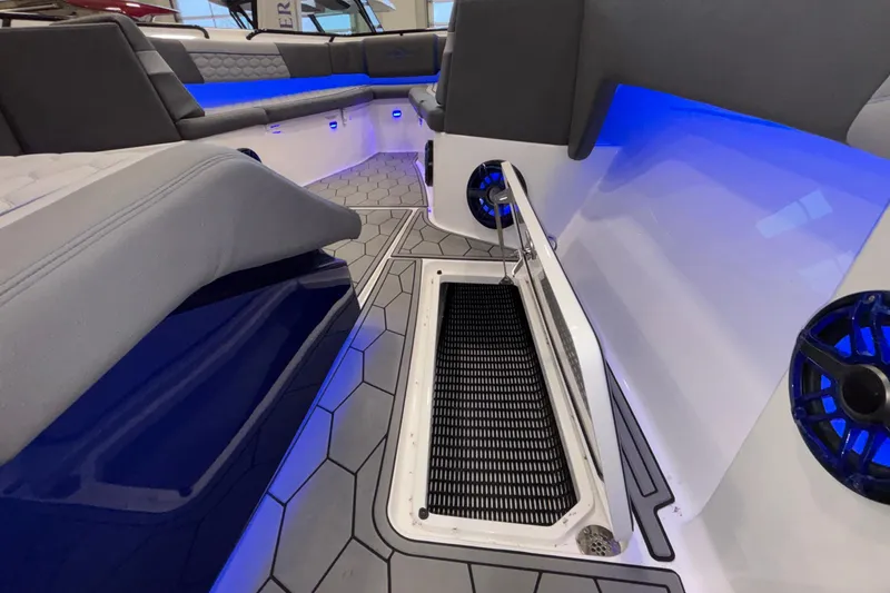Slide: The Image of 2022 Fountain 38 SC boat interior with blue LED lighting and hexagonal flooring. - 71