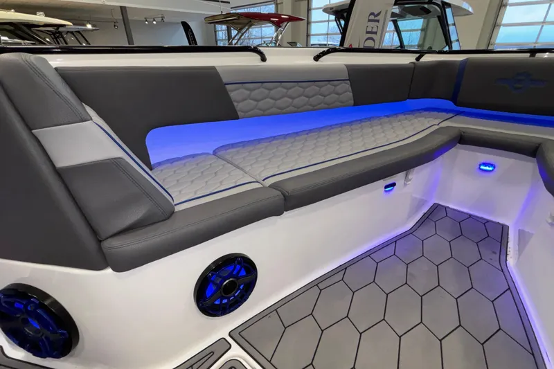Slide: The Image of Luxurious seating area with blue LED lighting on 2022 Fountain 38 SC boat. - 73
