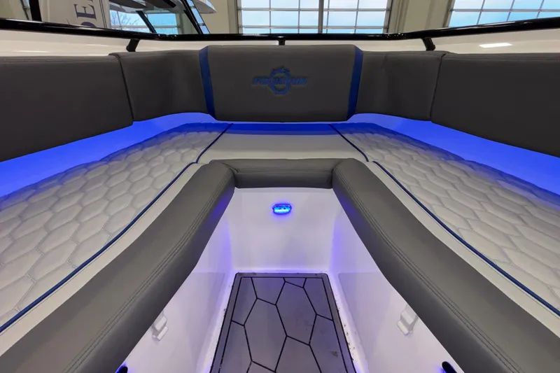Slide: The Image of Interior of 2022 Fountain 38 SC boat with blue LED lighting and cushioned seating. - 74