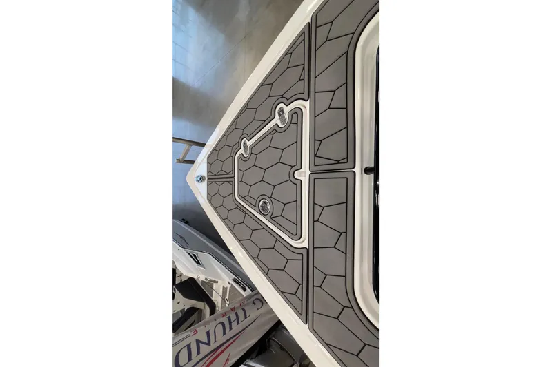 Slide: The Image of 2022 Fountain 38 SC boat deck with geometric pattern and sleek design. - 77