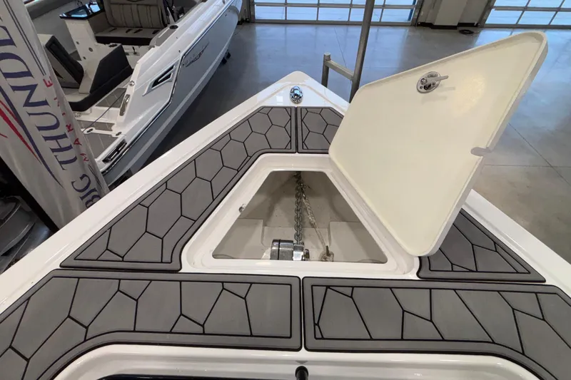 Slide: The Image of 2022 Fountain 38 SC boat anchor compartment with open hatch, showcasing modern design. - 78