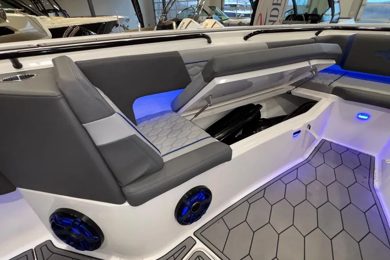 Slide: The Image of 2022 Fountain 38 SC boat interior with gray seating and blue LED lighting. - 84