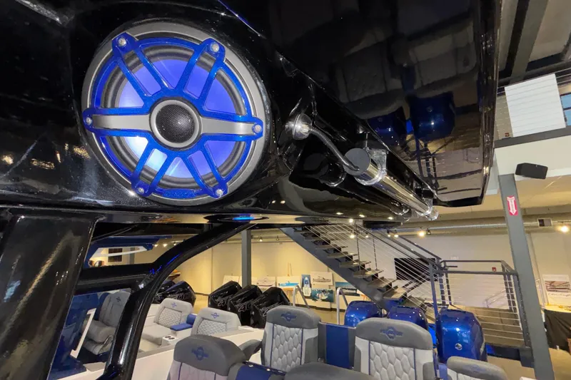 Slide: The Image of Interior of 2022 Fountain 38 SC boat with blue speaker and luxury seating. - 87