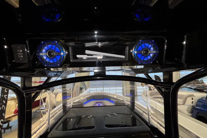 Slide: The Image of 2022 Fountain 38 SC boat interior with blue-lit speakers and modern design. - 88