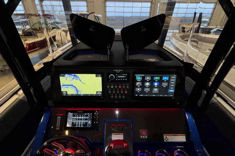 Slide: The Image of 2022 Fountain 38 SC boat dashboard with advanced navigation and control systems. - 89