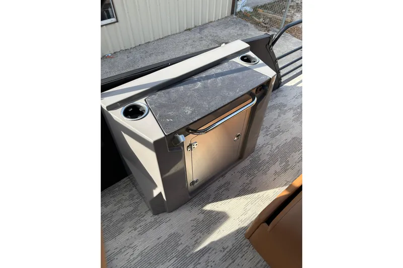 Slide: The Image of Starcraft RX 23 Q DH 2026 boat interior with sleek countertop and storage. - 15