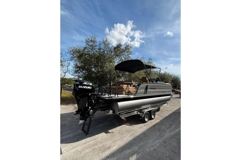 Slide: The Image of 2026 Starcraft RX 23 Q DH pontoon boat with Suzuki engine on a trailer. - 7