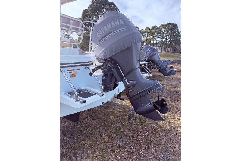 Slide: The Image of 2017 Parker 1801 Center Console with Yamaha outboard motors on grassy terrain. - 3