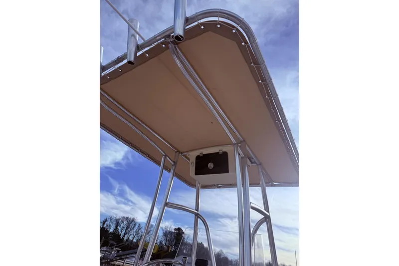 Slide: The Image of 2017 Parker 1801 Center Console boat with T-top under a clear sky. - 5