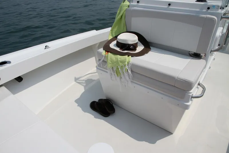 Slide: The Image of Manufacturer Provided Image: 2017 Parker 1801 Center Console boat interior with hat, scarf, and shoes. - 7