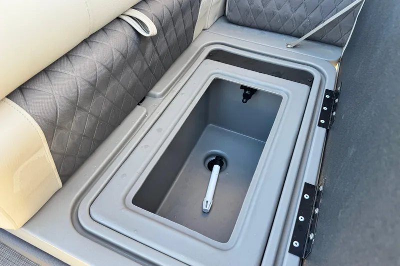 Slide: The Image of 2023 Sun Tracker Fishin' Barge 20 DLX livewell with cushioned seating and storage. - 14