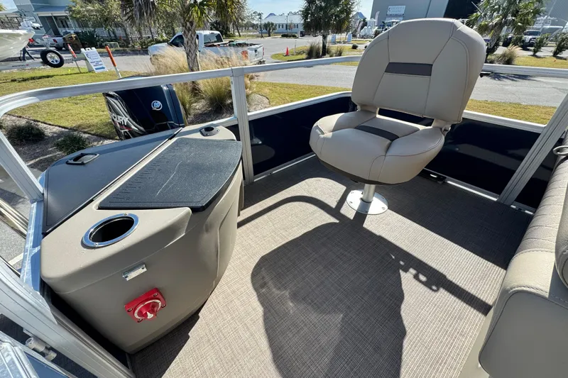 Slide: The Image of 2023 Sun Tracker Fishin' Barge 20 DLX interior with seating and console. - 19