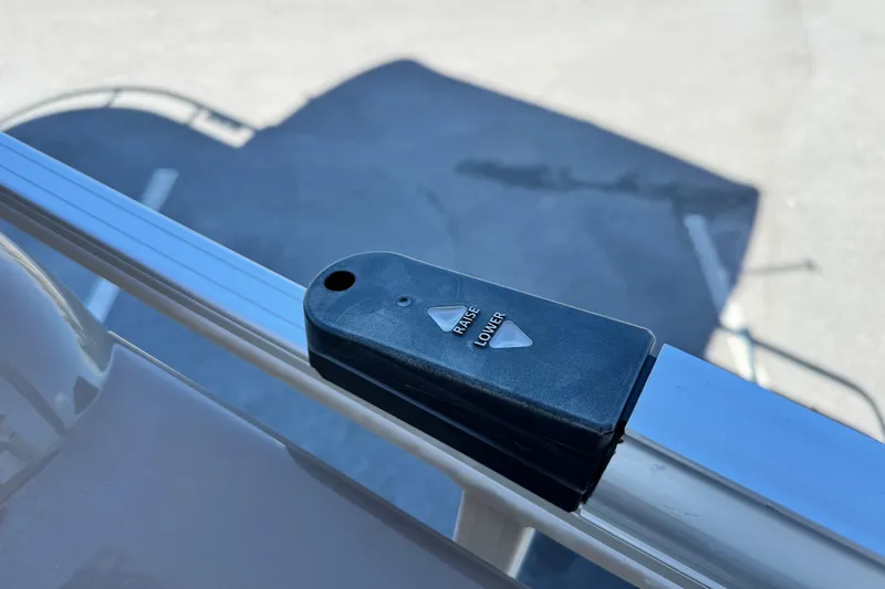 Slide: The Image of Control switch on 2023 Sun Tracker Fishin' Barge 20 DLX pontoon boat railing. - 22