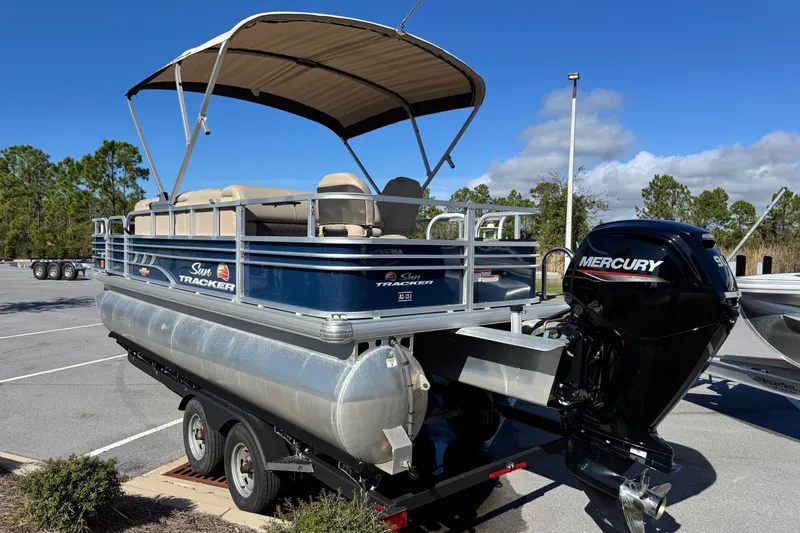 Slide: The Image of 2023 Sun Tracker Fishin' Barge 20 DLX pontoon boat with Mercury outboard engine. - 7