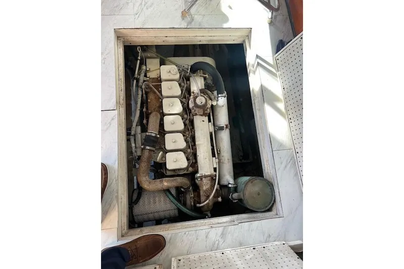 Slide: The Image of 1985 Sunnfjord 40 engine compartment with visible mechanical components. - 14