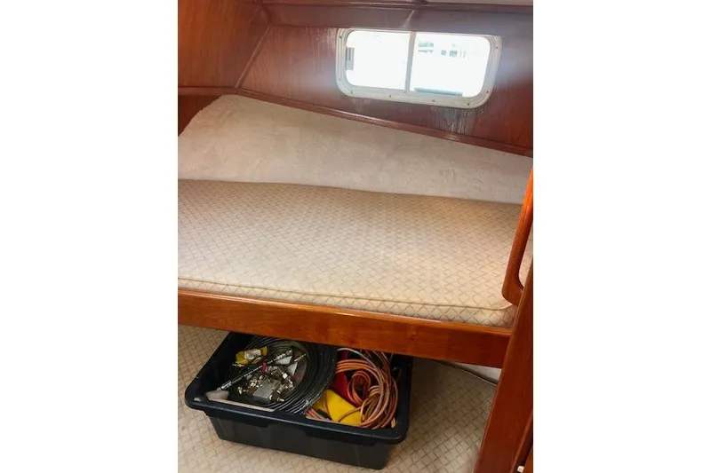 Slide: The Image of Interior of 1985 Sunnfjord 40 boat with storage under bed. - 17