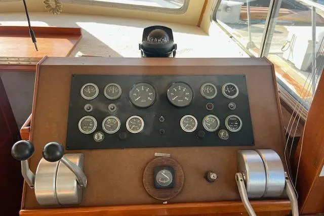 Slide: The Image of Control panel of a 1985 Sunnfjord 40 boat with gauges and levers. - 4
