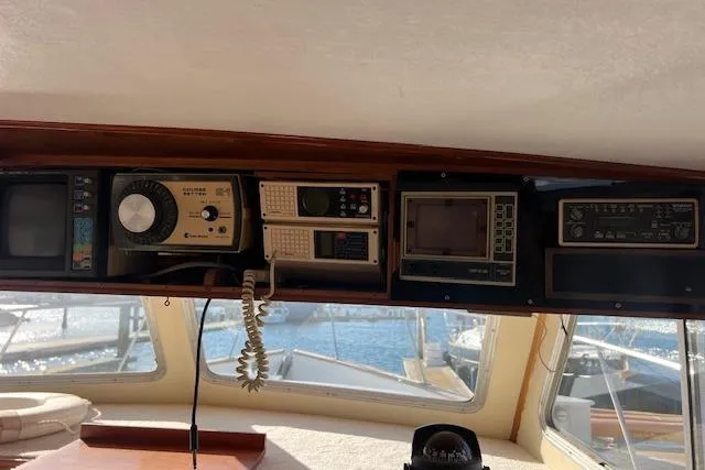 Slide: The Image of Control panel of a 1985 Sunnfjord 40 boat with vintage navigation equipment. - 6