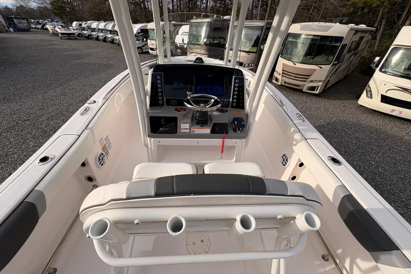 Slide: The Image of 2023 Robalo R230 Center Console boat interior with steering console and seating. - 12