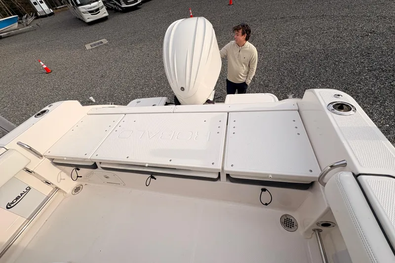 Slide: The Image of 2023 Robalo R230 Center Console boat with outboard motor and spacious deck. - 14