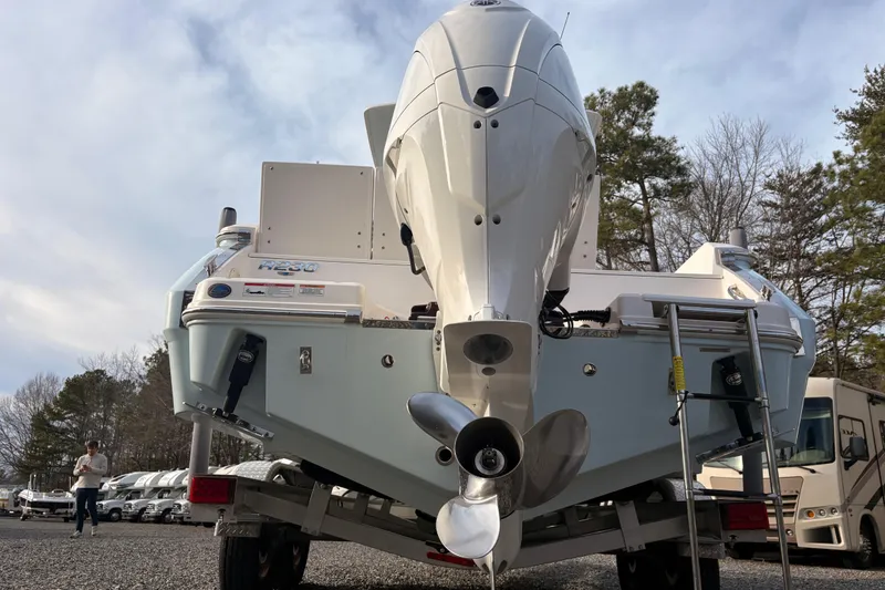 Slide: The Image of 2023 Robalo R230 Center Console boat on trailer, rear view with outboard motor. - 3