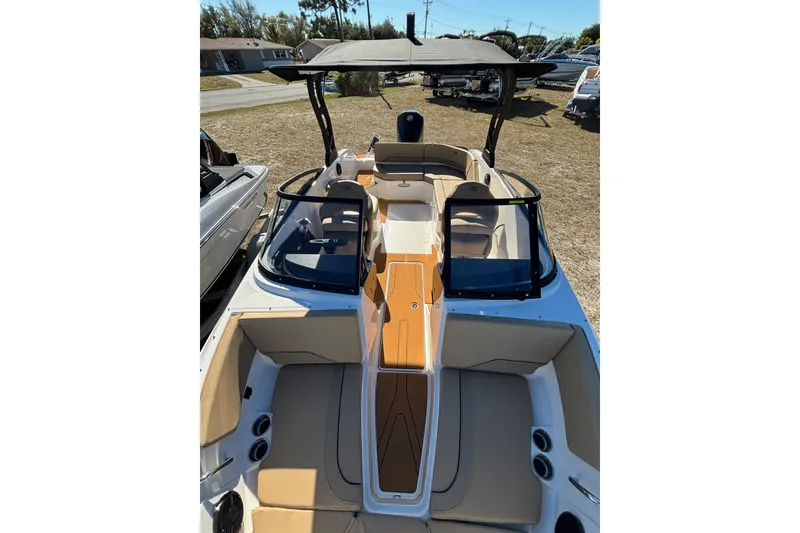 Slide: The Image of 2026 Bayliner V20 boat interior with tan seating and sleek design. - 15