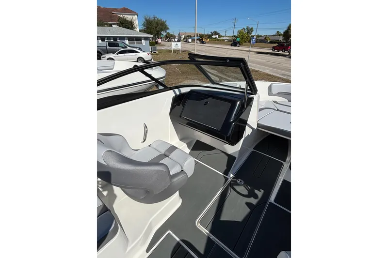 Slide: The Image of 2026 Bayliner V20 boat interior with modern seating and dashboard design. - 17