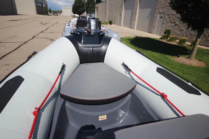 Slide: The Image of Zodiac Open 4.2 NEO 50hp boat, 2026 model, parked outdoors. - 12