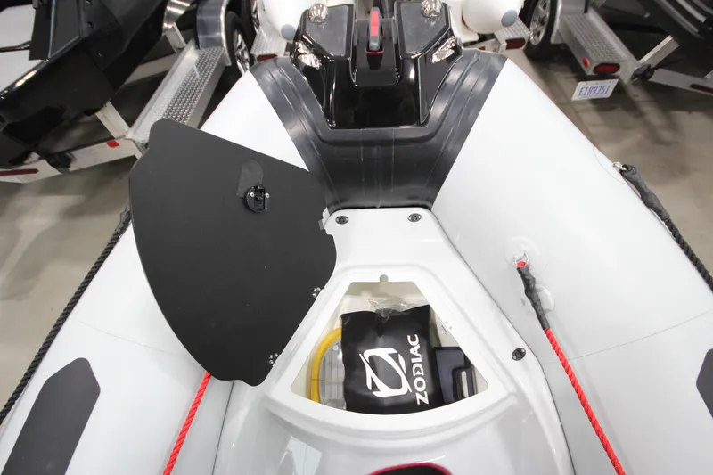 Slide: The Image of 2026 Zodiac Open 4.2 boat interior with storage compartment open. - 18