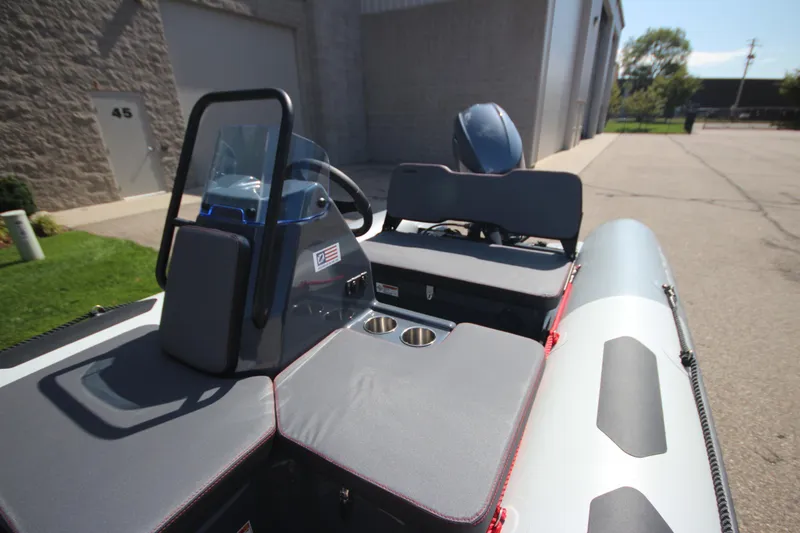 Slide: The Image of Zodiac Open 4.2 NEO 50hp boat, 2026 model, parked outside. - 5