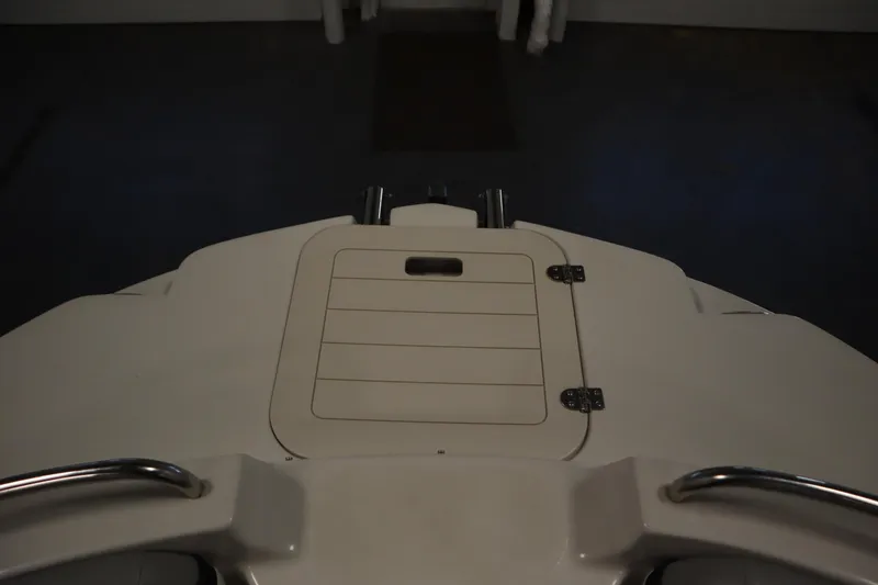 Slide: The Image of 2015 Starcraft 1915 OB Limited boat deck with storage compartment and metal railings. - 11