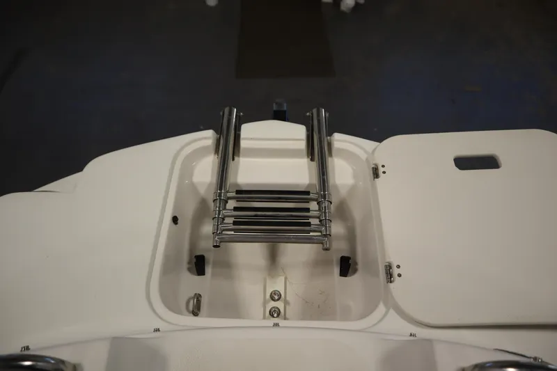 Slide: The Image of 2015 Starcraft 1915 OB Limited boat ladder compartment, open and ready for use. - 12