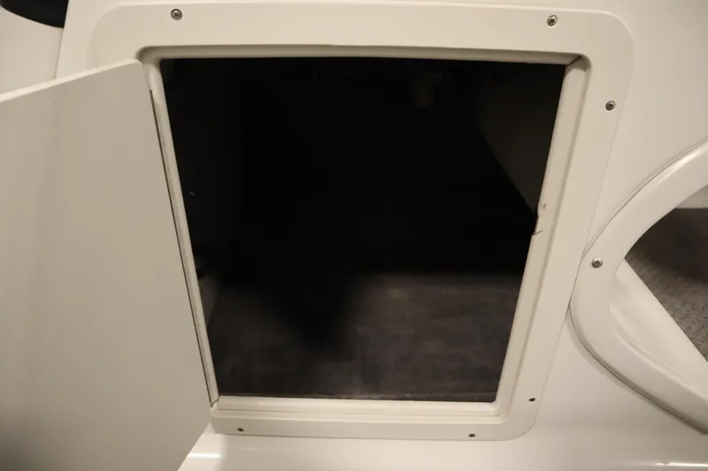 Slide: The Image of Open storage compartment on a 2015 Starcraft 1915 OB Limited boat. - 20