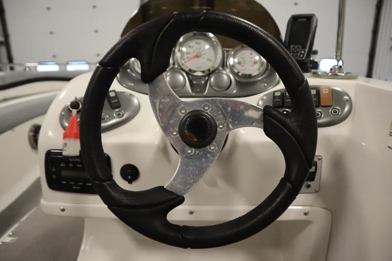 Slide: The Image of Steering wheel and dashboard of 2015 Starcraft 1915 OB Limited boat. - 22