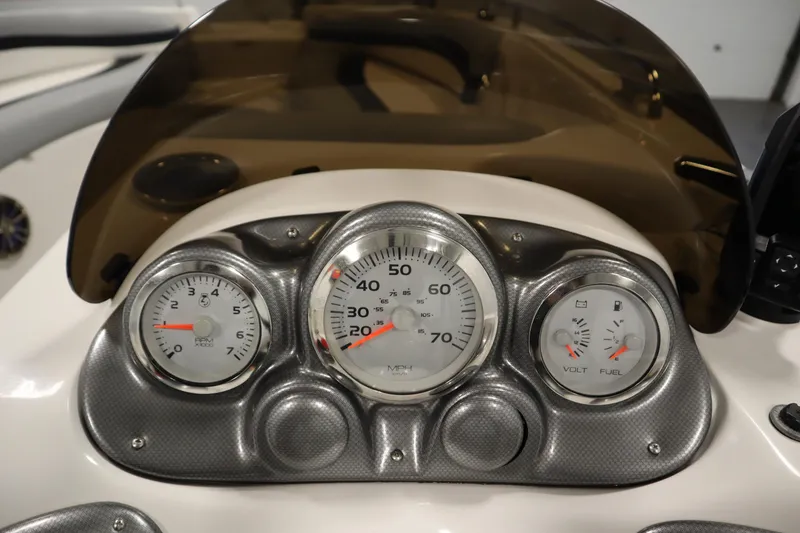 Slide: The Image of Dashboard of a 2015 Starcraft 1915 OB Limited boat with speedometer and gauges. - 23